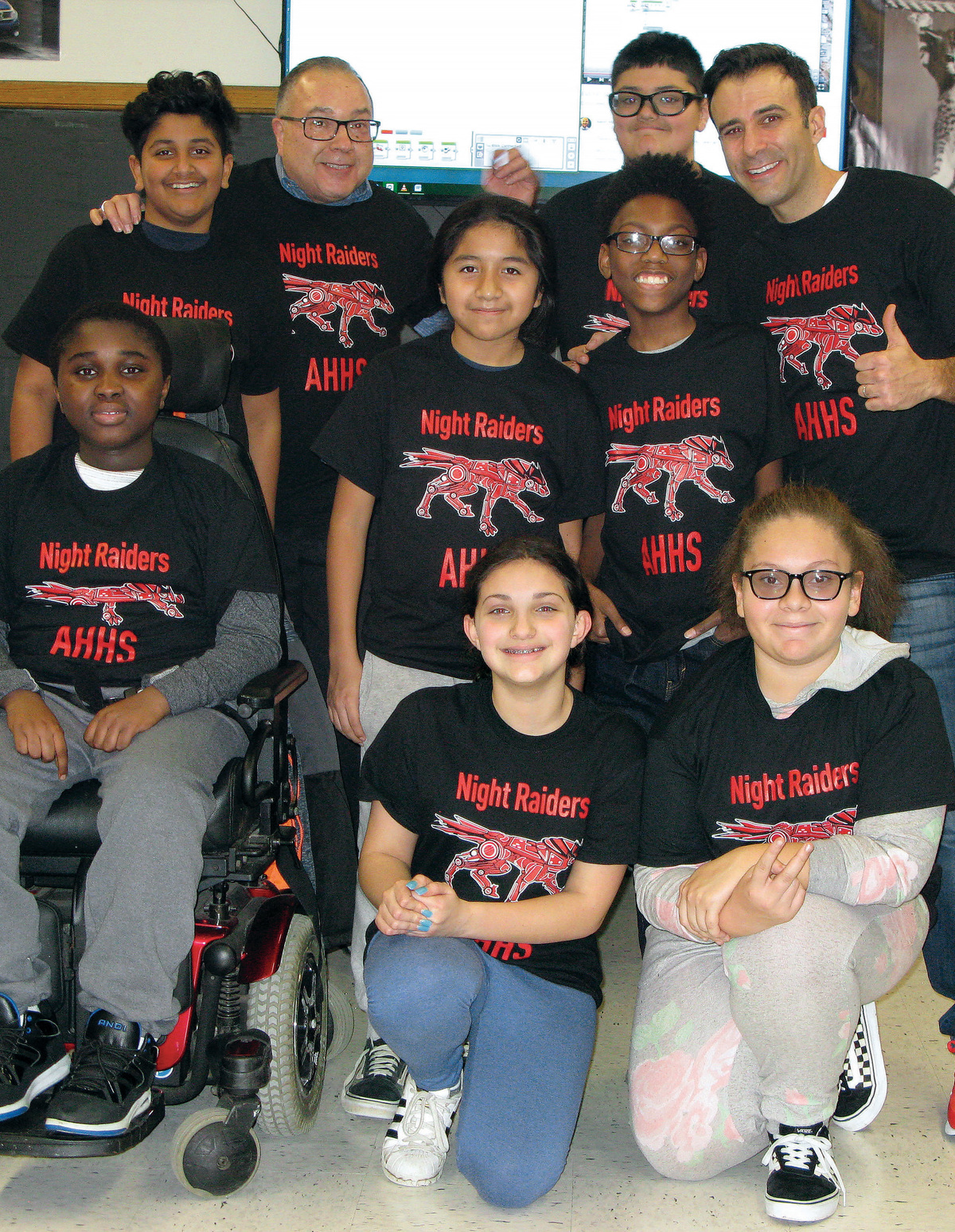 Alexander Hamilton High School principal Joseph Engelhardt (top right) in a pre-pandemic shot with the 2018–2019 Hamilton Robotics Club. Photo courtesy of Elmsford UFSD.