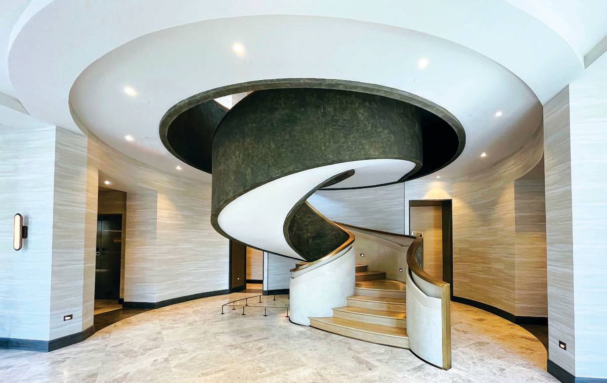 Dramatic swirl-like staircase design.